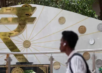 Indian rupee dragged by weak equities, hovers near record-low levels against yuan