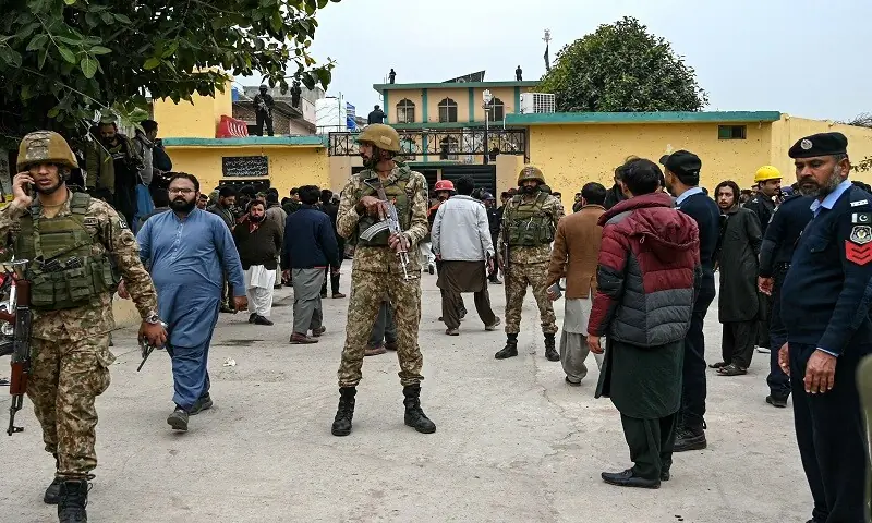 Security personnel stand guard outside an imambargah following an explosion, in Islamabad on February 6, 2026. —AFP
