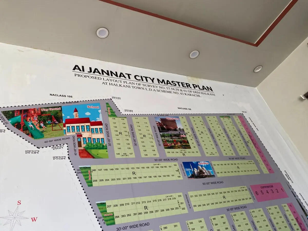  A masterplan of the housing society is plastered on a wall inside the Al Jannat City office. 