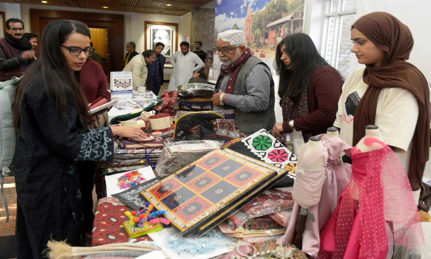 Visitors purchasing handmade arts and crafts from a stall during the third day of the Pakistan Mother Languages Literature Festival 2026, held on Sunday, February 15, at the Pakistan National Council of the Arts (PNCA ), Islamabad. &mdash; Muhammad Asim / White Star