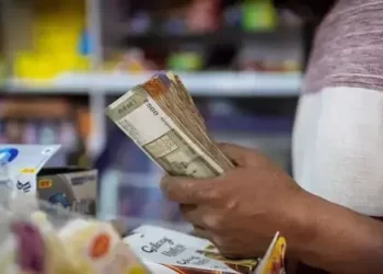 Indian rupee to nudge higher, traders parse US-India interim trade framework