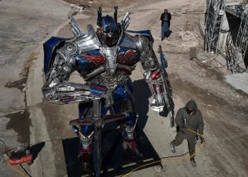 sculptor ehtisham jadoon working on a model of optimus prime a film character from transformers made from scrap metal at his studio on the outskirts of islamabad photo afp