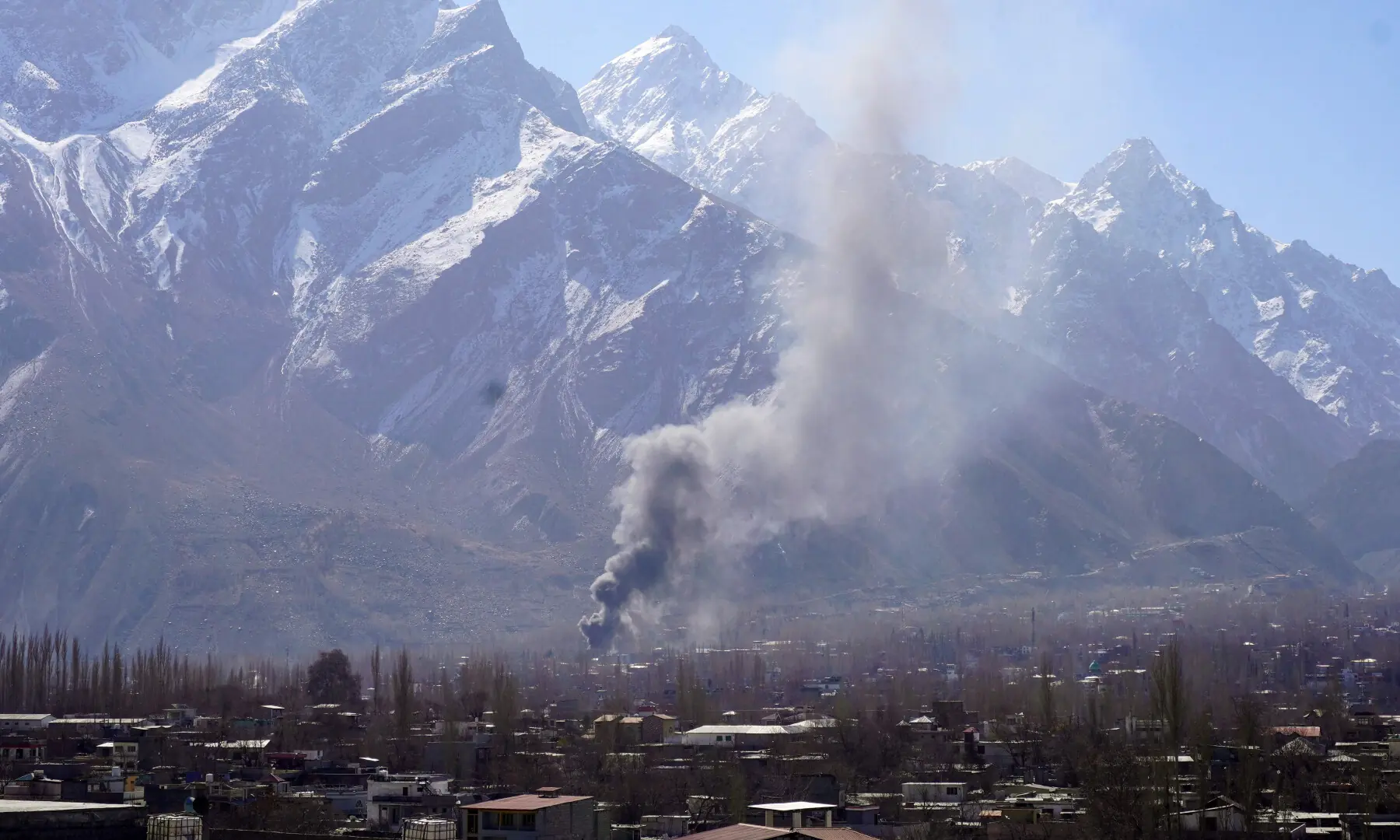 Smoke billows after protesters set fire to a United Nations office during an anti-US and Israel protest in Skardu in Gilgit-Baltistan on March 1, 2026. &mdash; AFP