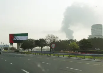Fire near Dubai airport under control after drone attack, flights suspended