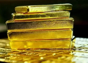 Gold set for third weekly fall on hawkish US Fed, elevated dollar