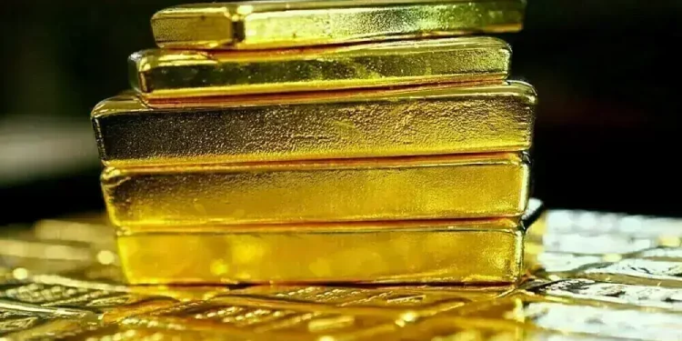Gold set for third weekly fall on hawkish US Fed, elevated dollar