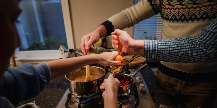 I'm polyamorous and my 2 partners and I live with our kids. Here's how we navigate coparenting together.