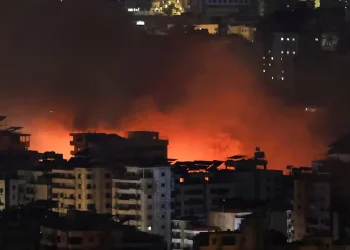 Israeli airstrikes pound Beirut suburb, Hezbollah warns Israelis