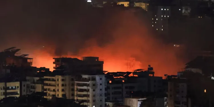 Israeli airstrikes pound Beirut suburb, Hezbollah warns Israelis