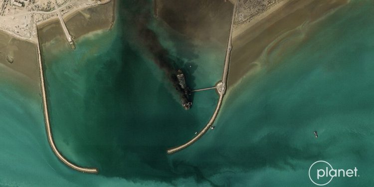 Satellite image shows Iran's largest naval vessel, a tanker-turned-warship, smoking in port