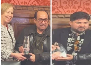 rahat fateh ali khan and his son shah zaman khan receving awards